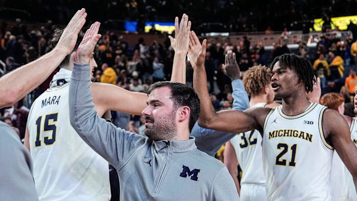Michigan basketball Director of Basketball Analytics Jacob Kohn high-fives players after 96-66 win over USC at Crisler Center in Ann Arbor on Friday, Jan. 2, 2026. Michigan basketball Director of Basketball Analytics Jacob Kohn high-fives players after 96-66 win over USC at Crisler Center in Ann Arbor on Friday, Jan. 2, 2026.
