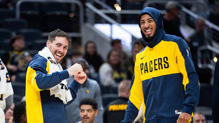 Oct 17, 2024; Indianapolis, Indiana, USA; Indiana Pacers guard T.J. McConnell (9) and  guard Tyrese Haliburton (0) cheer in the second half against the Charlotte Hornets at Gainbridge Fieldhouse. Mandatory Credit: Trevor Ruszkowski-Imagn Images