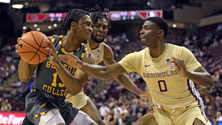 Feb 20, 2024; Tallahassee, Florida, USA; Boston College Eagles guard Donald Hand Jr. (13) is pressured by Florida State Seminoles guard Chandler Jackson (0) during the first half at Donald L. Tucker Center. Mandatory Credit: Melina Myers-Imagn Images