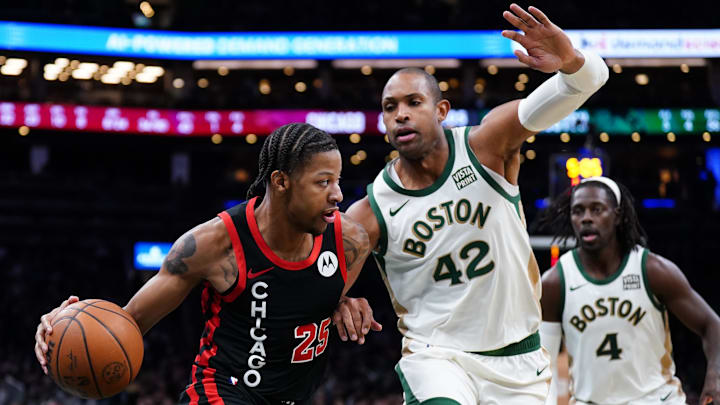 Nov 28, 2023; Boston, Massachusetts, USA; Chicago Bulls forward Dalen Terry (25) drives the ball against Boston Celtics center Al Horford (42) in the second half at TD Garden. Mandatory Credit: David Butler II-Imagn Images