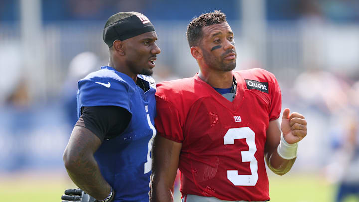 Aug 4, 2025; East Rutherford, NJ, USA; New York Giants wide receiver Malik Nabers (1) talks with quarterback Russell Wilson (3) during training camp at Quest Diagnostics Training Center. Mandatory Credit: Vincent Carchietta-Imagn Images