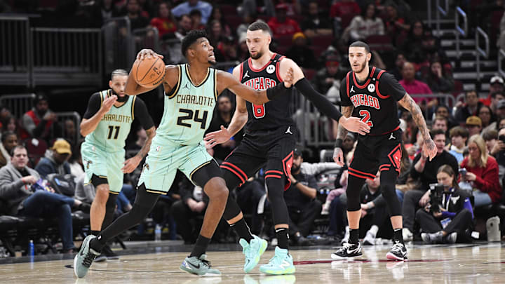 Dec 13, 2024; Chicago, Illinois, USA; Charlotte Hornets forward Brandon Miller (24) moves the ball against Chicago Bulls guard Zach LaVine (8) during the first half at the United Center. Mandatory Credit: Matt Marton-Imagn Images