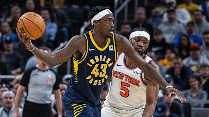 Feb 11, 2025; Indianapolis, Indiana, USA; Indiana Pacers forward Pascal Siakam (43) holds the ball while New York Knicks forward Precious Achiuwa (5) defends in the second half at Gainbridge Fieldhouse. Mandatory Credit: Trevor Ruszkowski-Imagn Images