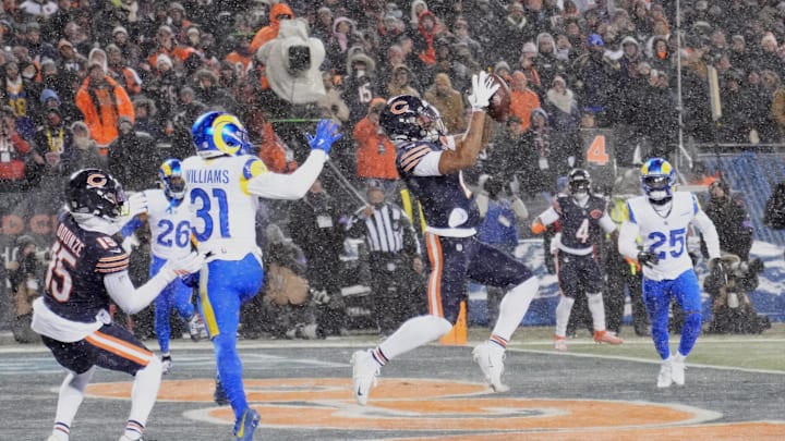 Jan 18, 2026; Chicago, IL, USA; Chicago Bears wide receiver DJ Moore (2) catches a three-yard touchdown pass thrown by quarterback Caleb Williams (not pictured) against Los Angeles Rams cornerback Darious Williams (31) during the second quarter of an NFC Divisional Round game at Soldier Field. Mandatory Credit: David Banks-Imagn Images