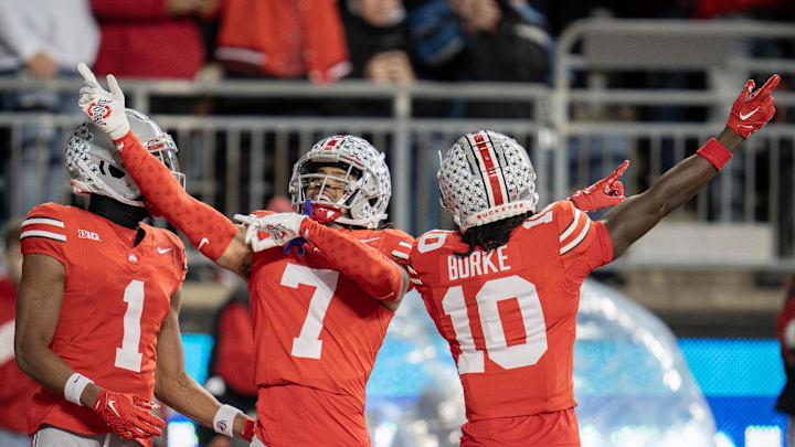 Nov 18, 2023; Columbus, Ohio, USA; 
Ohio State Buckeyes cornerback Jordan Hancock (7) celebrates an intercepted touchdown with Ohio State Buckeyes cornerback Denzel Burke (10) during the second half of their game on Saturday, Nov. 18, 2023 at Ohio Stadium.