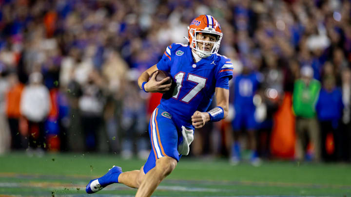 Florida Gators quarterback Max Brown (17) rushes with the ball during the second half against the Florida State Seminoles at Steve Spurrier Field at Ben Hill Griffin Stadium in Gainesville, FL on Saturday, November 25, 2023. [Matt Pendleton/Gainesville Sun]