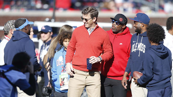 Dec 20, 2025; Oxford, MS, USA; Eli Manning former Mississippi Rebels quarterback and NFL star visits the field prior to a game against the Tulane Green Wave at Vaught-Hemingway Stadium. Mandatory Credit: Petre Thomas-Imagn Images