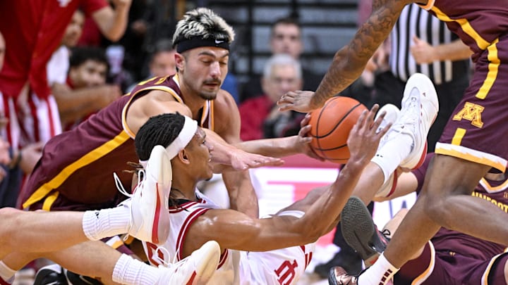 Dec 9, 2024; Bloomington, Indiana, USA; Indiana Hoosiers forward Malik Reneau (5) chases after a loose ball in front of Minnesota Golden Gophers forward Dawson Garcia (3) during the first half at Simon Skjodt Assembly Hall. Mandatory Credit: Robert Goddin-Imagn Images Dec 9, 2024; Bloomington, Indiana, USA; Indiana Hoosiers forward Malik Reneau (5) chases after a loose ball in front of Minnesota Golden Gophers forward Dawson Garcia (3) during the first half at Simon Skjodt Assembly Hall. Mandatory Credit: Robert Goddin-Imagn Images