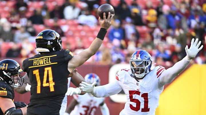 Nov 19, 2023; Landover, Maryland, USA; New York Giants linebacker Azeez Ojulari (51) pressures Washington Commanders quarterback Sam Howell (14) during the second half at FedExField. Nov 19, 2023; Landover, Maryland, USA; New York Giants linebacker Azeez Ojulari (51) pressures Washington Commanders quarterback Sam Howell (14) during the second half at FedExField.
