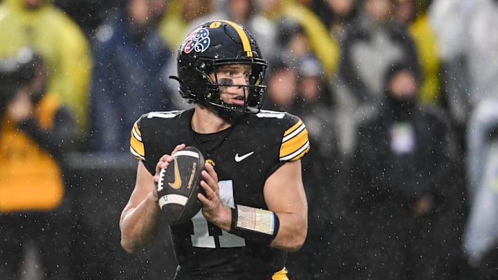 Nov 8, 2025; Iowa City, Iowa, USA; Iowa Hawkeyes quarterback Mark Gronowski (11) prepares to throw a pass against the Oregon Ducks during the first quarter at Kinnick Stadium. Mandatory Credit: Jeffrey Becker-Imagn Images