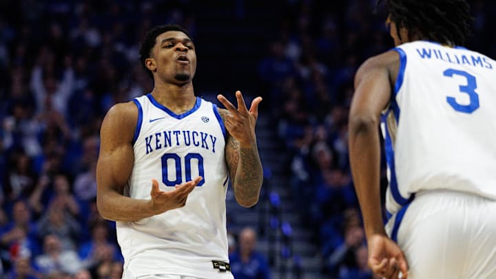 Dec 23, 2025; Lexington, Kentucky, USA; Kentucky Wildcats guard Otega Oweh (00) reacts after guard Kam Williams (3) makes a three point basket during the second half against the Bellarmine Knights at Rupp Arena at Central Bank Center. Mandatory Credit: Jordan Prather-Imagn Images