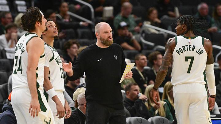 Oct 5, 2026; Milwaukee, Wisconsin, USA;  Milwaukee Bucks head coach Taylor Jenkins talks to forward Jaime Jaquez Jr. (24), guard Ryan Rollins (13) and guard Kevin Porter (7) in the first quarter against the Minnesota Timberwolves at Fiserv Forum.  Mandatory Credit: Benny Sieu-Imagn Images