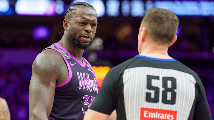 Feb 20, 2026; Minneapolis, Minnesota, USA; Minnesota Timberwolves forward Julius Randle (30) talks with referee Josh Tiven (58) in the fourth quarter against the Dallas Mavericks at Target Center.