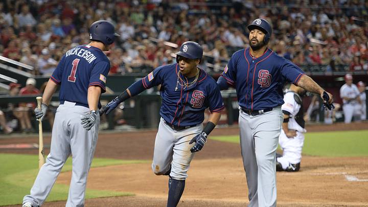 San Diego Padres third baseman Yangervis Solarte (26) slaps hands with left fielder Alex Dickerson (1) and right fielder Matt Kemp (27) after hitting a solo home run during the fourth inning against the Arizona Diamondbacks at Chase Field. San Diego Padres third baseman Yangervis Solarte (26) slaps hands with left fielder Alex Dickerson (1) and right fielder Matt Kemp (27) after hitting a solo home run during the fourth inning against the Arizona Diamondbacks at Chase Field.