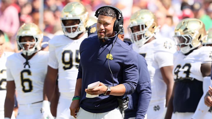 Sep 27, 2025; Fayetteville, Arkansas, USA; Notre Dame Fighting Irish head coach Marcus Freeman during the first quarter against the Arkansas Razorbacks at Donald W. Reynolds Razorback Stadium. Mandatory Credit: Nelson Chenault-Imagn Images