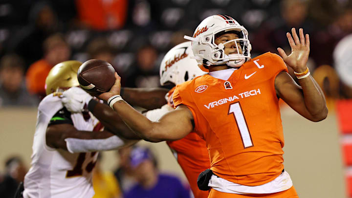 Oct 17, 2024; Blacksburg, Virginia, USA; Virginia Tech Hokies quarterback Kyron Drones (1) throws a pass during the third quarter against the Boston College Eagles at Lane Stadium. Mandatory Credit: Peter Casey-Imagn Images