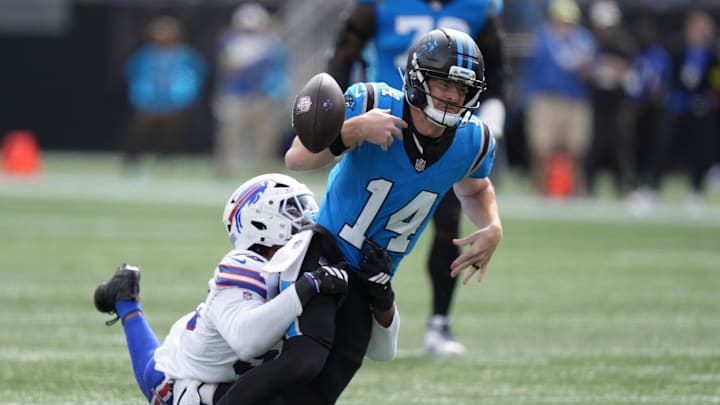 Oct 26, 2025; Charlotte, North Carolina, USA; Buffalo Bills defensive end Greg Rousseau (50) causes a fumble by Carolina Panthers quarterback Andy Dalton (14) during the first half at Bank of America Stadium. Mandatory Credit: Jim Dedmon-Imagn Images Oct 26, 2025; Charlotte, North Carolina, USA; Buffalo Bills defensive end Greg Rousseau (50) causes a fumble by Carolina Panthers quarterback Andy Dalton (14) during the first half at Bank of America Stadium. Mandatory Credit: Jim Dedmon-Imagn Images