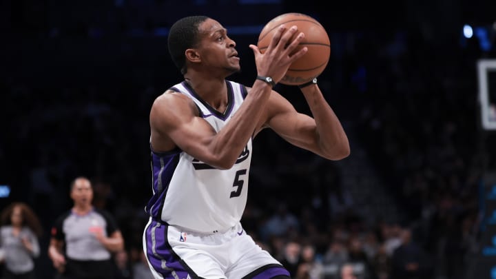 Apr 7, 2024; Brooklyn, New York, USA; Sacramento Kings guard De'Aaron Fox (5) shoots a three point Apr 7, 2024; Brooklyn, New York, USA; Sacramento Kings guard De'Aaron Fox (5) shoots a three point