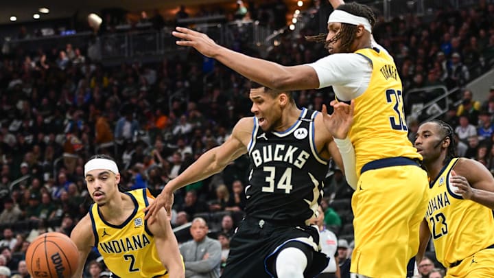 Apr 27, 2025; Milwaukee, Wisconsin, USA; Milwaukee Bucks forward Giannis Antetokounmpo (34) reaches for a rebound against Indiana Pacers center Myles Turner (33) and guard Andrew Nembhard (2) in the third quarter during game four of first round for the 2024 NBA Playoffs at Fiserv Forum. Mandatory Credit: Benny Sieu-Imagn Images Apr 27, 2025; Milwaukee, Wisconsin, USA; Milwaukee Bucks forward Giannis Antetokounmpo (34) reaches for a rebound against Indiana Pacers center Myles Turner (33) and guard Andrew Nembhard (2) in the third quarter during game four of first round for the 2024 NBA Playoffs at Fiserv Forum. Mandatory Credit: Benny Sieu-Imagn Images