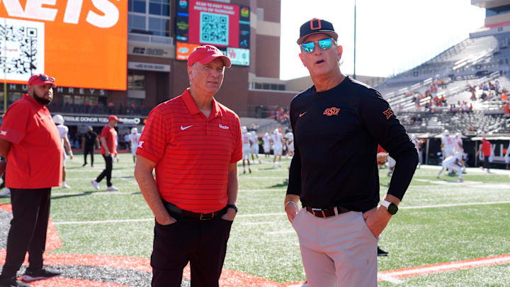 Oklahoma State interim coach Doug Meacham, right, talks with Houston coach Willie Fritz before a college football game between the Oklahoma State Cowboys (OSU) and the Houston Cougars at Boone Pickens Stadium in Stillwater, Okla., Saturday, Oct. 11, 2025. Oklahoma State interim coach Doug Meacham, right, talks with Houston coach Willie Fritz before a college football game between the Oklahoma State Cowboys (OSU) and the Houston Cougars at Boone Pickens Stadium in Stillwater, Okla., Saturday, Oct. 11, 2025.