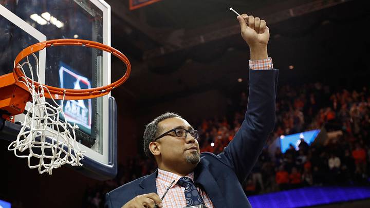 Mar 9, 2019; Charlottesville, VA, USA; Virginia Cavaliers associate head coach Jason Williford cuts down the net after the Cavaliers clinched a share of the ACC regular season championship after their game against the Louisville Cardinals at John Paul Jones Arena. Mandatory Credit: Geoff Burke-USA TODAY Sports