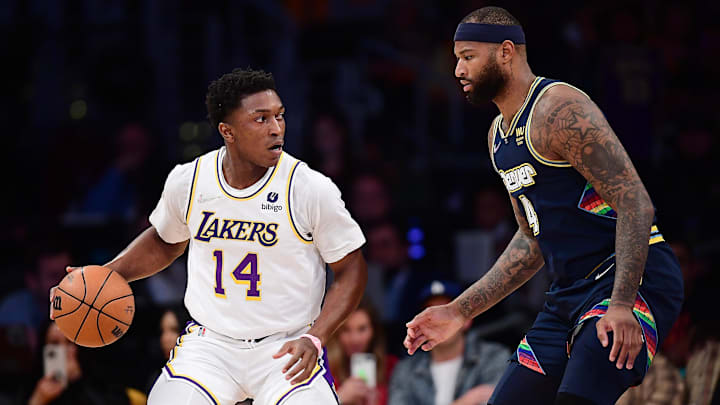Apr 3, 2022; Los Angeles, California, USA; Los Angeles Lakers forward Stanley Johnson (14) moves the ball against Denver Nuggets center DeMarcus Cousins (4) during the first half at Crypto.com Arena. Mandatory Credit: Gary A. Vasquez-Imagn Images Apr 3, 2022; Los Angeles, California, USA; Los Angeles Lakers forward Stanley Johnson (14) moves the ball against Denver Nuggets center DeMarcus Cousins (4) during the first half at Crypto.com Arena. Mandatory Credit: Gary A. Vasquez-Imagn Images