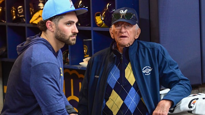 Apr 2, 2024; Milwaukee, Wisconsin, USA; Milwaukee Brewers radio announcer Bob Uecker talks to outfielder Garrett Mitchell before game against the Minnesota Twins at American Family Field.
