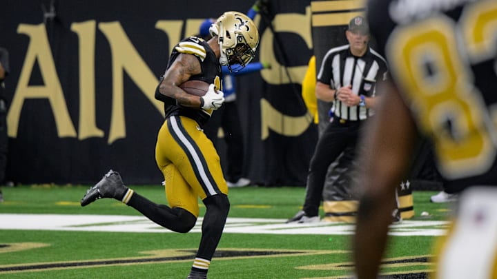 Oct 17, 2024; New Orleans, Louisiana, USA; New Orleans Saints wide receiver Cedrick Wilson Jr. (11) scores a touchdown late in the fourth quarter against the Denver Broncos at Caesars Superdome. Mandatory Credit: Matthew Hinton-Imagn Images