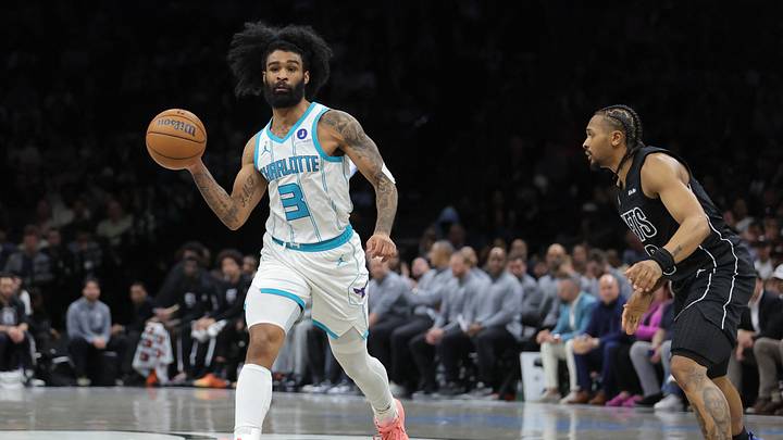 Charlotte Hornets guard Coby White (3) passes the ball against Brooklyn Nets guard Tyson Etienne Charlotte Hornets guard Coby White (3) passes the ball against Brooklyn Nets guard Tyson Etienne