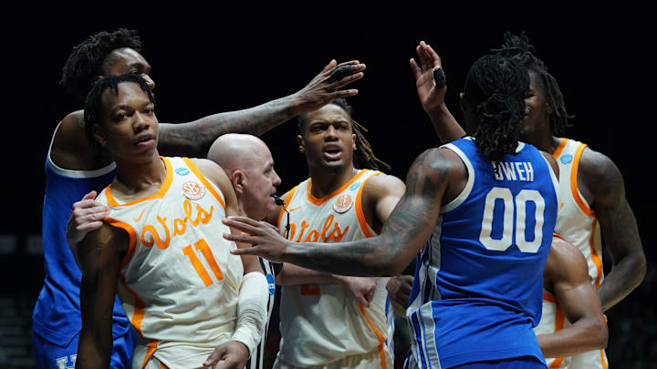 Mar 28, 2025; Indianapolis, IN, USA;Tennessee Volunteers guard Jordan Gainey (11) and Kentucky Wildcats guard Otega Oweh (00) shove each other  in the second half during a Midwest Regional semifinal of the 2025 NCAA tournament at Lucas Oil Stadium. Mandatory Credit: Robert Goddin-Imagn Images