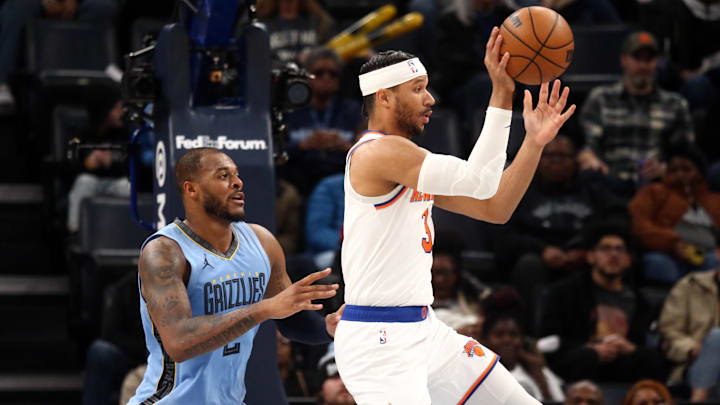 Jan 13, 2024; Memphis, Tennessee, USA; New York Knicks guard Josh Hart (3) passes the ball as Memphis Grizzlies forward Xavier Tillman (2) defends during the second half at FedExForum. Mandatory Credit: Petre Thomas-Imagn Images