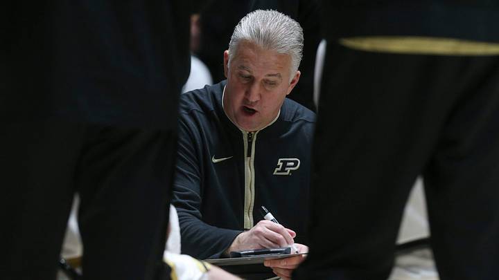 Purdue Boilermakers head coach Matt Painter leads a team huddle.