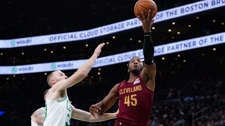 Oct 29, 2025; Boston, Massachusetts, USA; Cleveland Cavaliers guard Donovan Mitchell (45) drives the ball to the basket against Boston Celtics forward Sam Hauser (30) in the second half at TD Garden. Mandatory Credit: David Butler II-Imagn Images