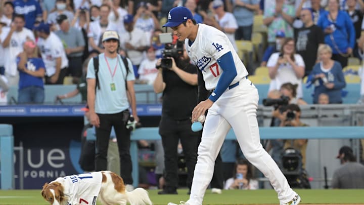 Decoy, the dog of Los Angeles Dodgers designated hitter Shohei Ohtani (17) delivered the first pitch before the game against the Baltimore Orioles at Dodger Stadium on Aug 28. Decoy, the dog of Los Angeles Dodgers designated hitter Shohei Ohtani (17) delivered the first pitch before the game against the Baltimore Orioles at Dodger Stadium on Aug 28.