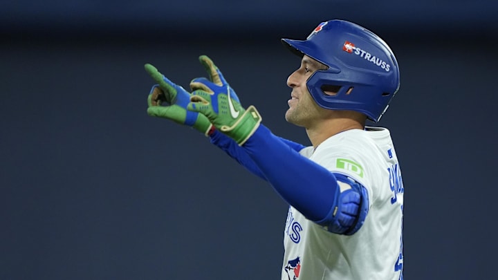 Nov 1, 2025; Toronto, Ontario, CAN; Toronto Blue Jays right fielder George Springer (4) reacts after hitting a single in the fourth inning against the Los Angeles Dodgers during game seven of the 2025 MLB World Series at Rogers Centre. 