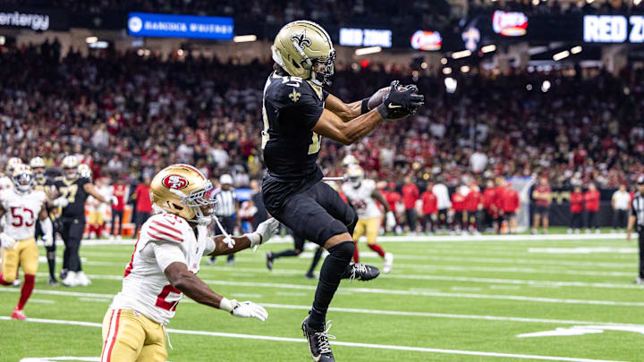 Sep 14, 2025; New Orleans, Louisiana, USA; New Orleans Saints wide receiver Chris Olave (12) catches a pass against San Francisco 49ers cornerback Upton Stout (20) during the second half at Caesars Superdome. Mandatory Credit: Stephen Lew-Imagn Images Sep 14, 2025; New Orleans, Louisiana, USA; New Orleans Saints wide receiver Chris Olave (12) catches a pass against San Francisco 49ers cornerback Upton Stout (20) during the second half at Caesars Superdome. Mandatory Credit: Stephen Lew-Imagn Images