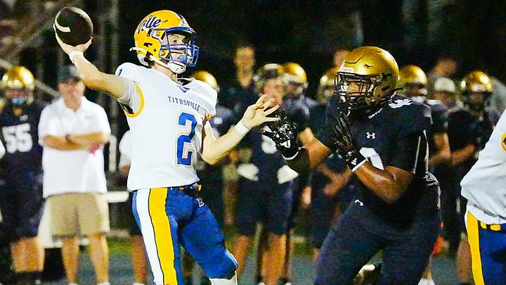 Titusville quarterback Remy Vigne is pressured by Jadiel Corbin of Holy Trinity during their game on Aug. 28, 2026. Vigne last week completed 11 of 18 passes for 174 yards and three touchdowns to power the Terriers past Davenport, 43-6. Titusville quarterback Remy Vigne is pressured by Jadiel Corbin of Holy Trinity during their game on Aug. 28, 2026. Vigne last week completed 11 of 18 passes for 174 yards and three touchdowns to power the Terriers past Davenport, 43-6.