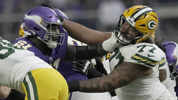 Jan 4, 2026; Minneapolis, Minnesota, USA; Green Bay Packers guard Jordan Morgan (77) blocks Minnesota Vikings defensive tackle Jalen Redmond (61) during the first quarter at U.S. Bank Stadium. Mandatory Credit: Mark Hoffman-USA TODAY Network via Imagn Images