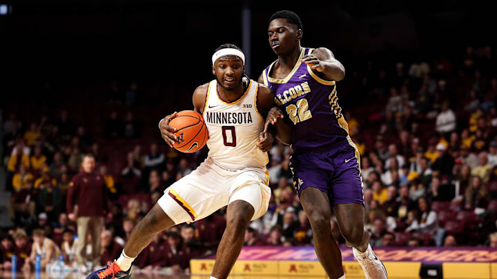 Nov 8, 2025; Minneapolis, Minnesota, USA; Minnesota Golden Gophers guard Chansey Willis Jr. (0) drives towards the basket as Alcorn State Braves guard Mike Jones (22) defends during the first half at Williams Arena. Mandatory Credit: Matt Krohn-Imagn Images