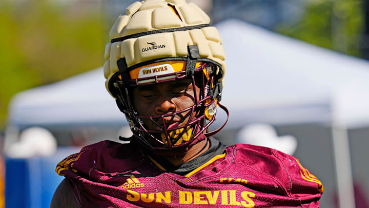 Arizona State offensive lineman Max Iheanachor warms up during the first day of fall practice