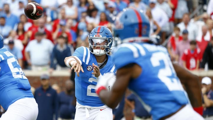 Sep 28, 2024; Oxford, Mississippi, USA; Mississippi Rebels quarterback Jaxson Dart (2) passes the ball to running back Henry Parrish Jr. (21) during the first half against the Kentucky Wildcats at Vaught-Hemingway Stadium. Mandatory Credit: Petre Thomas-Imagn Images Sep 28, 2024; Oxford, Mississippi, USA; Mississippi Rebels quarterback Jaxson Dart (2) passes the ball to running back Henry Parrish Jr. (21) during the first half against the Kentucky Wildcats at Vaught-Hemingway Stadium. Mandatory Credit: Petre Thomas-Imagn Images
