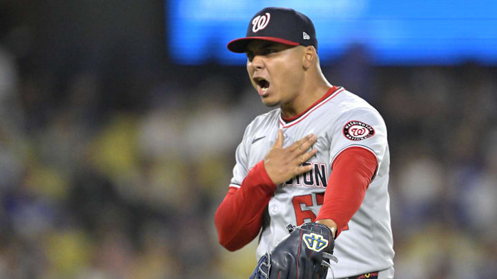 Jun 20, 2025; Los Angeles, California, USA;  Washington Nationals relief pitcher Eduardo Salazar (62) reacts after getting Los Angeles Dodgers shortstop Mookie Betts (50) to ground out to end the eighth inning at Dodger Stadium. Mandatory Credit: Jayne Kamin-Oncea-Imagn Images