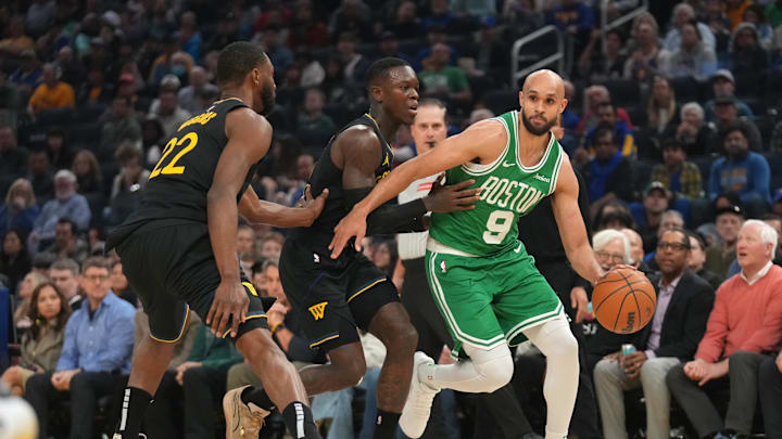 Jan 20, 2025; San Francisco, California, USA; Boston Celtics guard Derrick White (9) dribbles the ball next to Golden State Warriors guard Dennis Schroder (71) in the first quarter at the Chase Center. Mandatory Credit: Cary Edmondson-Imagn Images
