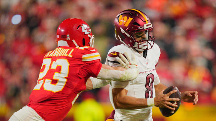 Oct 27, 2025; Kansas City, Missouri, USA; Washington Commanders quarterback Marcus Mariota (8) scrambles with the ball defended by Kansas City Chiefs linebacker Drue Tranquill (23) during the second quarter of the game at GEHA Field at Arrowhead Stadium. Mandatory Credit: Jay Biggerstaff-Imagn Images Oct 27, 2025; Kansas City, Missouri, USA; Washington Commanders quarterback Marcus Mariota (8) scrambles with the ball defended by Kansas City Chiefs linebacker Drue Tranquill (23) during the second quarter of the game at GEHA Field at Arrowhead Stadium. Mandatory Credit: Jay Biggerstaff-Imagn Images