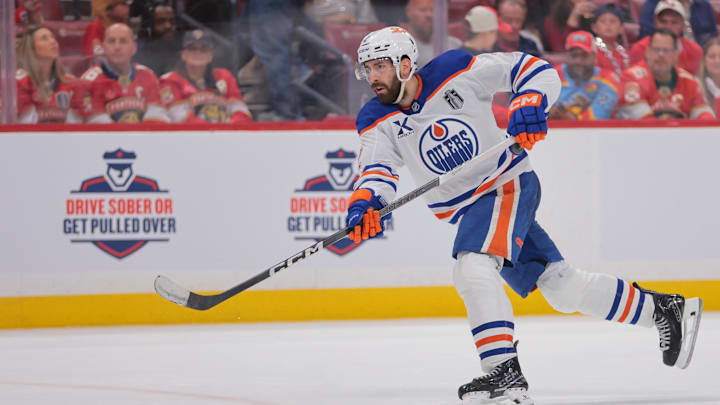 Jun 9, 2025; Sunrise, Florida, USA; Edmonton Oilers defenseman Evan Bouchard (2) shoots the puck during the third period against the Florida Panthers  in game three of the 2025 Stanley Cup Final at Amerant Bank Arena. Mandatory Credit: Sam Navarro-Imagn Images