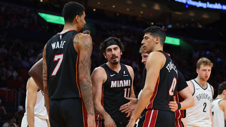 Mar 3, 2026; Miami, Florida, USA; Miami Heat forward Jaime Jaquez Jr. (11) speaks to center Kel'el Ware (7) and forward Simone Fontecchio (0) during the second quarter against the Brooklyn Nets at Kaseya Center. Mandatory Credit: Sam Navarro-Imagn Images