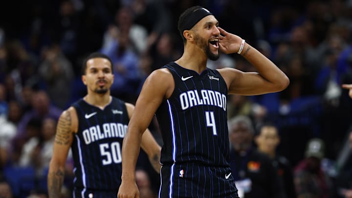 Orlando Magic guards Jalen Suggs (4) and Cole Anthony (50) celebrate after a basket against the Washington Wizards during the second half at Amway Center.