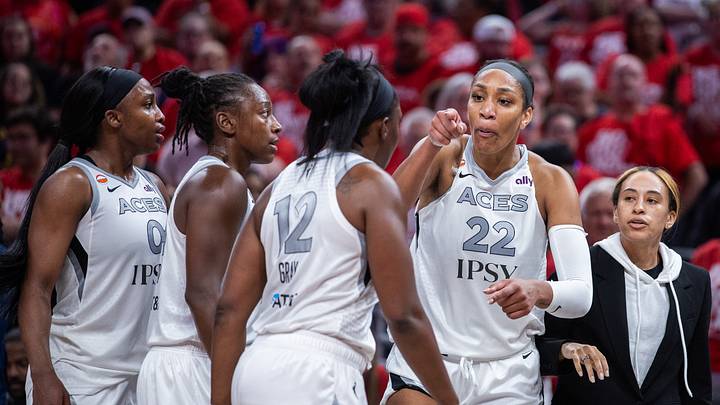 Sep 29, 2026; Indianapolis, Indiana, USA;  Las Vegas Aces center A'ja Wilson (22) talks to a teammates after she went into the stands to confront a fan during game two of the first round for the 2026 WNBA Playoffs against the Indiana Fever at Gainbridge Fieldhouse.  Mandatory Credit: Trevor Ruszkowski-Imagn Images