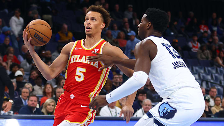 Mar 3, 2025; Memphis, Tennessee, USA; Atlanta Hawks guard Dyson Daniels (5) drives to the basket as Memphis Grizzlies forward Jaren Jackson Jr. (13) defends during the first quarter at FedExForum. Mandatory Credit: Petre Thomas-Imagn Images