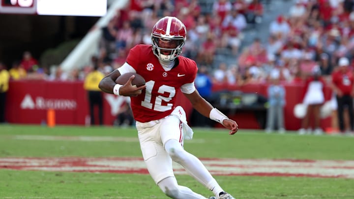 Nov 22, 2025; Tuscaloosa, Alabama, USA; Alabama Crimson Tide quarterback Keelon Russell (12) carries the ball during the second half against the Eastern Illinois Panthers at Saban Field at Bryant-Denny Stadium. 